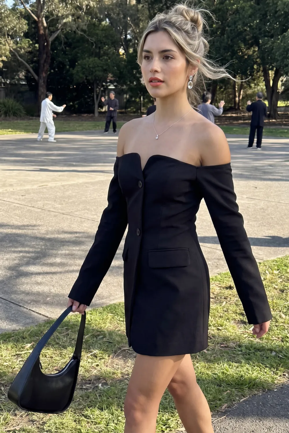 Woman in black off shoulder blazer mini dress